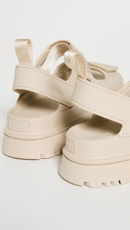 UGG Women's GOLDENGLOW Flat Sandal, SEA Salt, 8